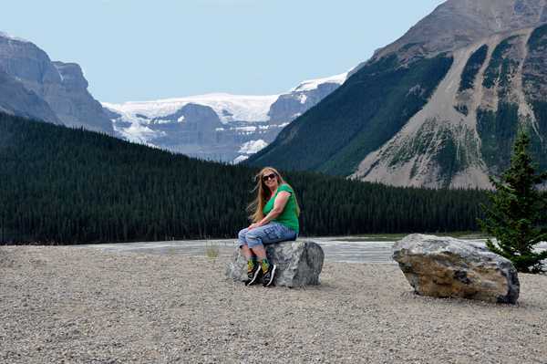 Karen Duquette in front of a glacier and river